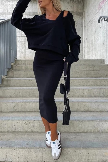 Sleeveless long ribbed knit dress with plunging neckline.