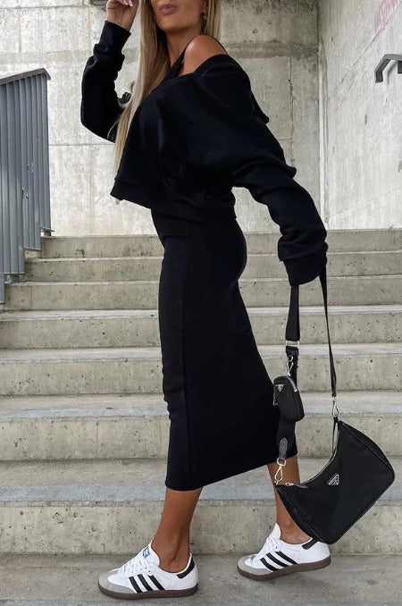 Sleeveless long ribbed knit dress with plunging neckline.